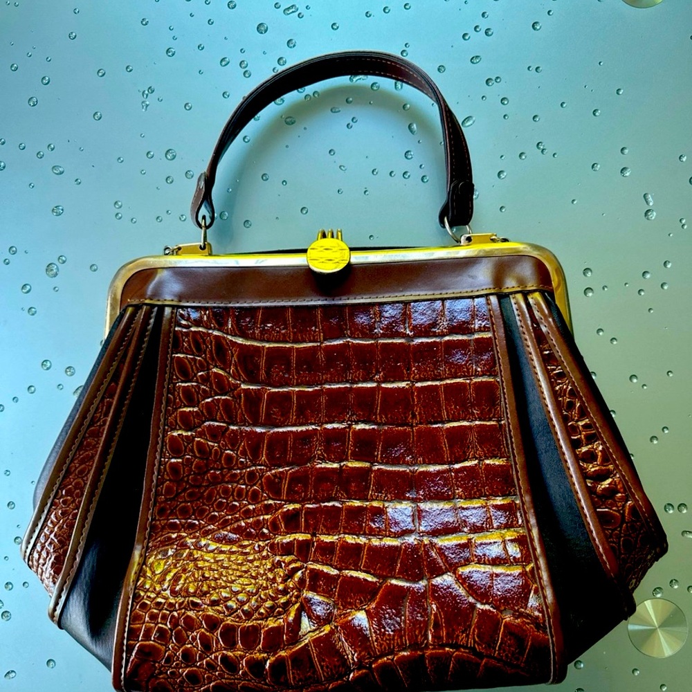 Beautiful bag brown laquer with black leather.